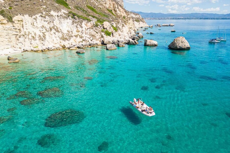 Cagliari: Zodiac Boat Tour, 3-4 SwimStops, Wine & Snorkeling - Cala Fighera: cliffs, photos, and clear water