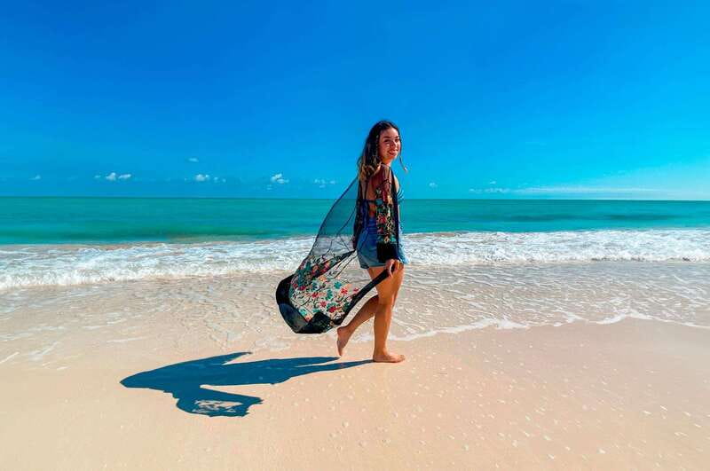 Cancun: Speedboat tour to a Virgin Beach - Timing, cancellation, and language