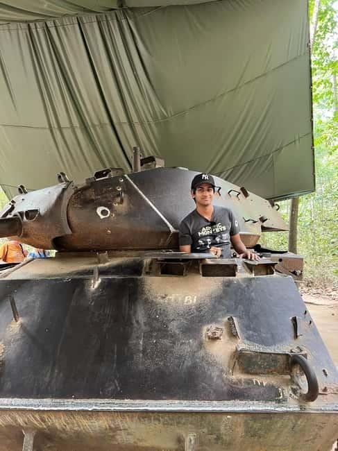 From HCM: Cu Chi Tunnels Half-Day Tour by Speedboat or Bus - Entering the secret entrance and crawling underground