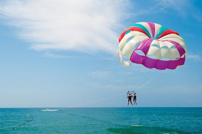 Ile aux Cerf: Speed boat with Parasailing & Tube Riding and Lunch - Parasailing above the Mauritius lagoon