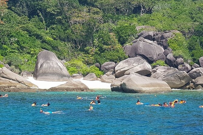 Koh Tao & Koh Nang Yuan Snorkeling Tour by Speed Boat from Samui - Koh Nang Yuan: sandbar, snorkel water, and a crowded viewpoint