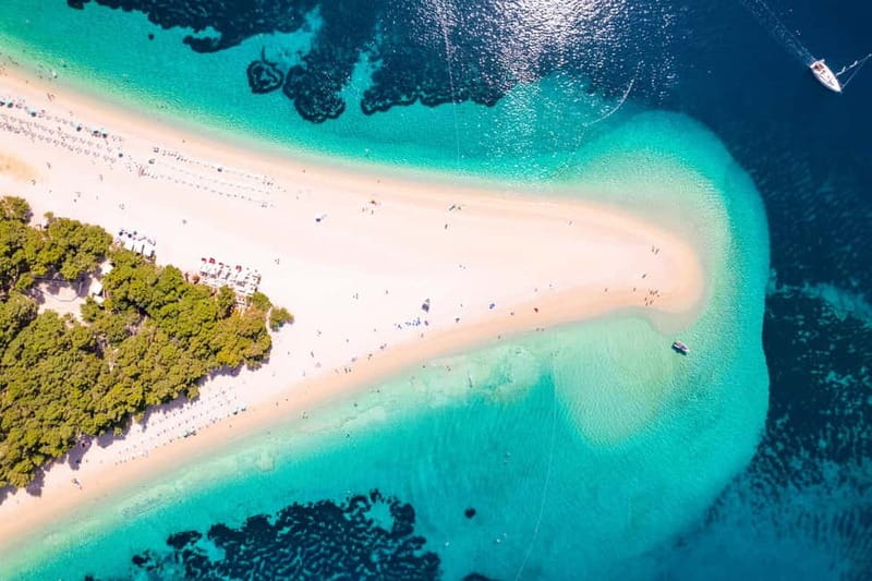 Makarska: 3-Island Speedboat Golden Horn & Blue Lagoon Tour - Nugal Beach starts the morning with cliffs and quiet water