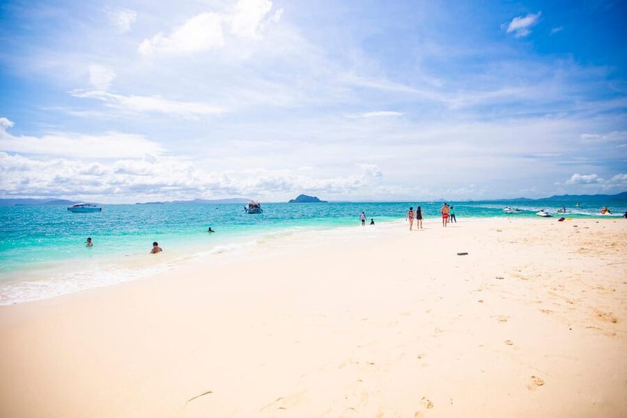 Phuket: Khai Islands Premium Speedboat Half Day Adventure - Khai Nui: rocks, water, and a shorter swim stop