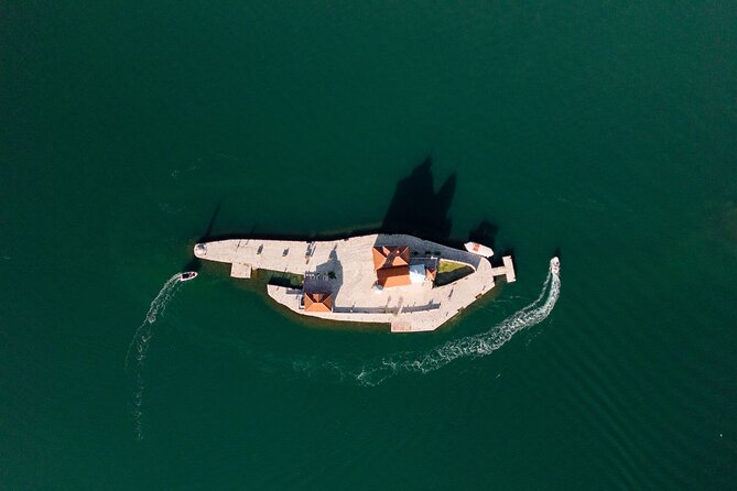 Private Guided Tour in Kotor Bay with Speedboat Food and Wine - Sitting down for Montenegrin food and wine