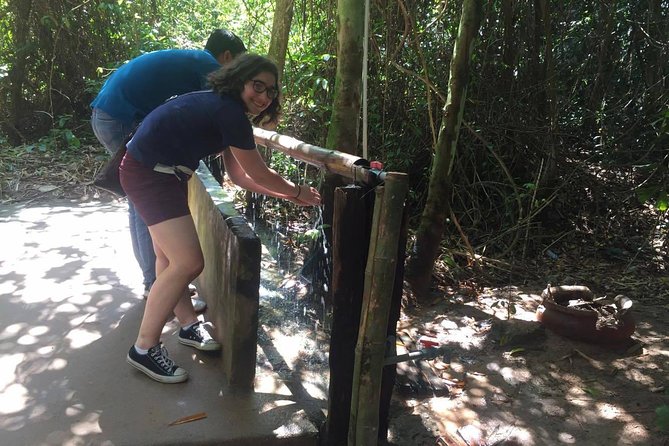 Private Half Day Cu Chi Tunnels Tour by AC Car or Speedboat - Going below ground at Cu Chi