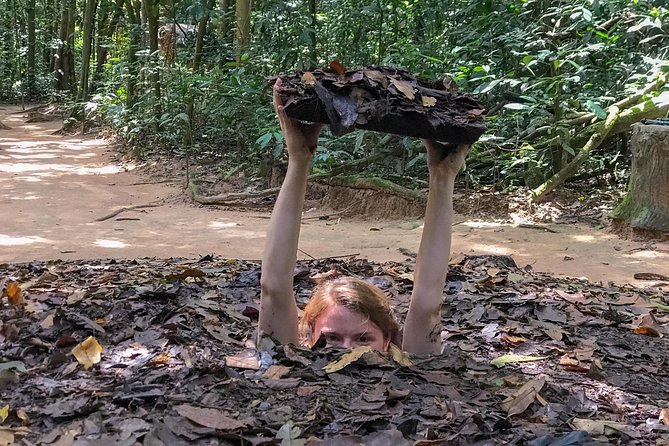 Private Half Day Cu Chi Tunnels Tour by AC Car or Speedboat - Watching the documentary at Ben Dinh