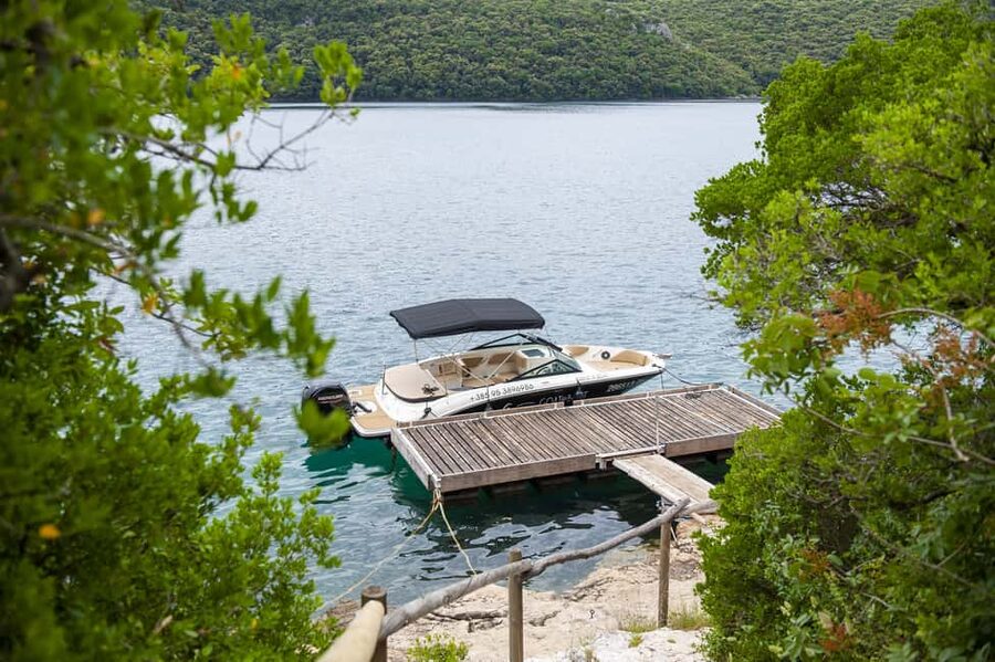 Rovinj or Vrsar: Lim Fjord & Rovinj islands Speedboat Tour - Red Island’s small harbor and old buildings