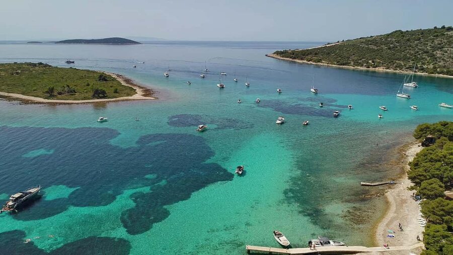 Trogir: Blue Lagoon and 3 Islands Speedboat Tour - Blue Lagoon: beautiful water, busy shore