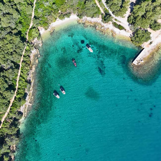 Zadar: Original Island-Hopping Speedboat Tour - Preko: sandy beach, Galevac, shops, and cafés